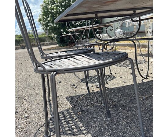Large handmade wrought iron outdoor table with six chairs. Dimensions: 182 x 112 cm