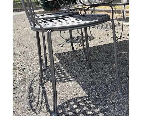 Large handmade wrought iron outdoor table with six chairs. Dimensions: 182 x 112 cm