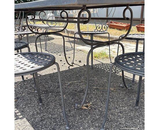 Large handmade wrought iron outdoor table with six chairs. Dimensions: 182 x 112 cm