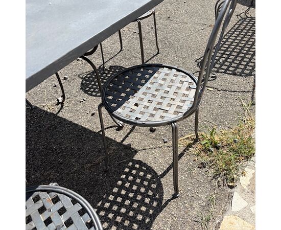 Large handmade wrought iron outdoor table with six chairs. Dimensions: 182 x 112 cm