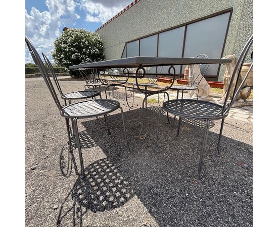 Large handmade wrought iron outdoor table with six chairs. Dimensions: 182 x 112 cm