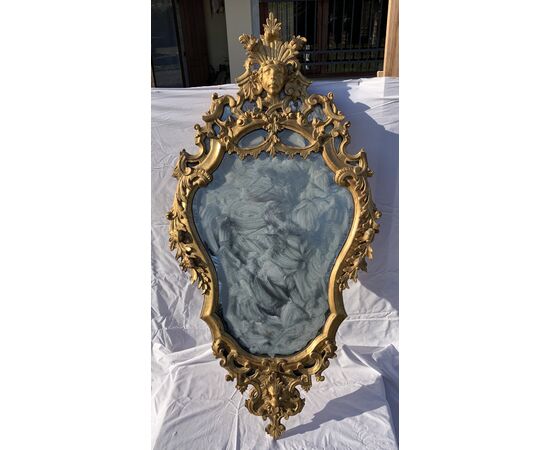 Pair of carved and gilded wooden mirrors. Italy, 18th century.