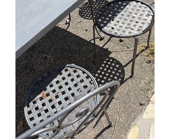 Large handmade wrought iron outdoor table with six chairs. Dimensions: 182 x 112 cm