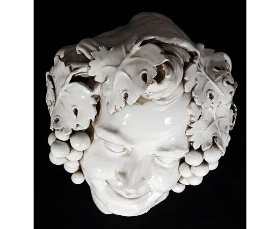 Head of Bacchus in white glazed terracotta
