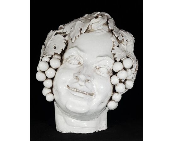 Head of Bacchus in white glazed terracotta