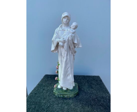 Madonna with Child in white majolica with base and polychrome roses and inscription: Rosa Mystica. Minghetti Manufacture, Bologna.     