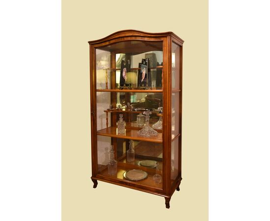 Showcase in walnut with molding     