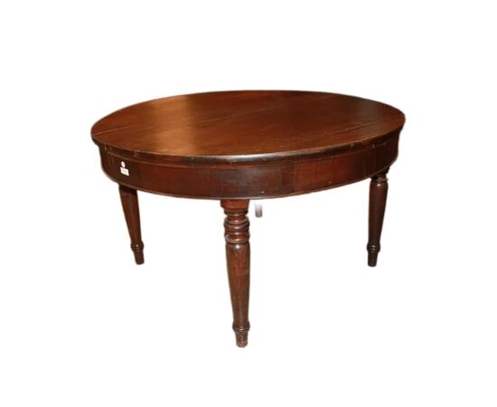 Large round extendable walnut table from the early 1800s