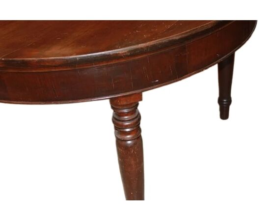 Large round extendable walnut table from the early 1800s