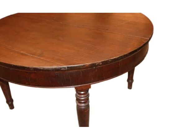 Large round extendable walnut table from the early 1800s