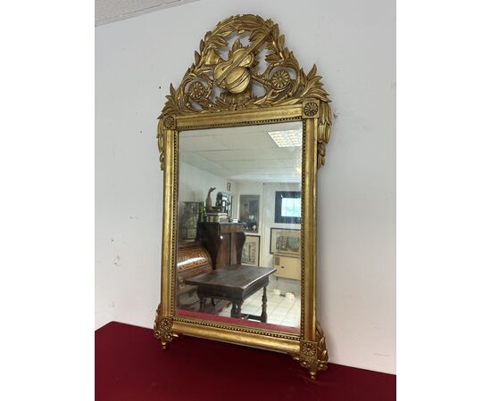 Carved and gilded wooden mirror, Tuscan Empire period, first half of the 19th century