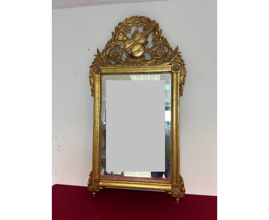 Carved and gilded wooden mirror, Tuscan Empire period, first half of the 19th century