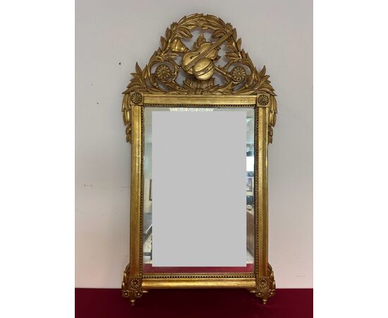 Carved and gilded wooden mirror, Tuscan Empire period, first half of the 19th century