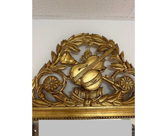 Carved and gilded wooden mirror, Tuscan Empire period, first half of the 19th century
