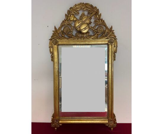 Carved and gilded wooden mirror, Tuscan Empire period, first half of the 19th century