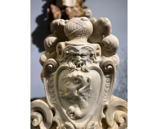 Large heraldic coat of arms carved in marble