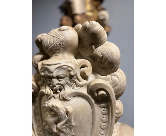 Large heraldic coat of arms carved in marble