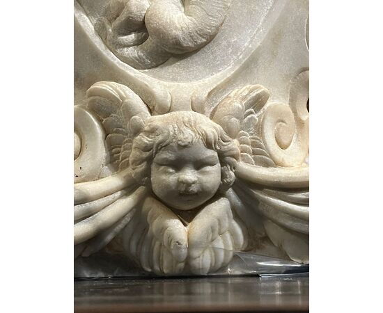 Large heraldic coat of arms carved in marble