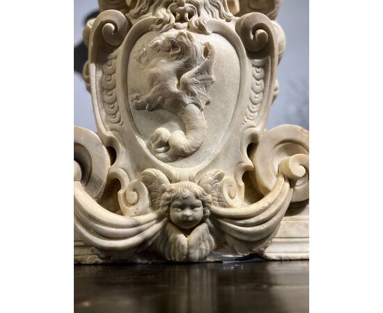 Large heraldic coat of arms carved in marble
