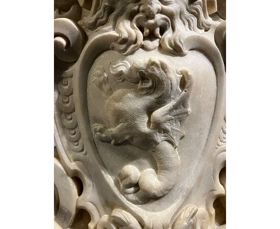 Large heraldic coat of arms carved in marble