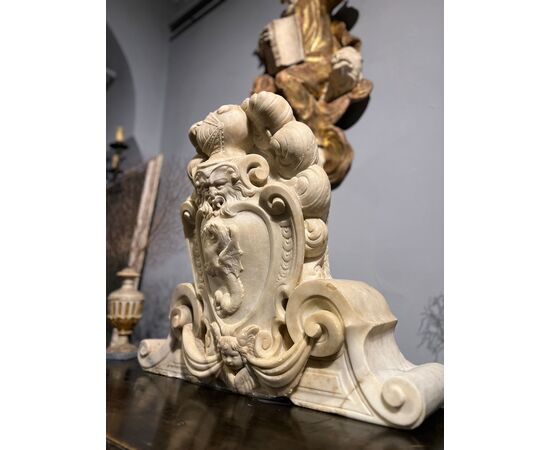 Large heraldic coat of arms carved in marble