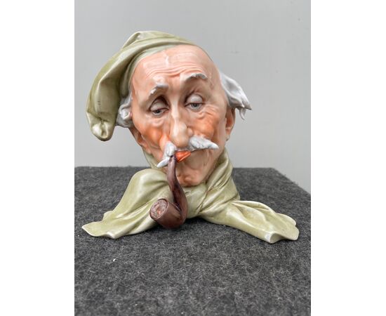Porcelain sculpture depicting a male head with hat and pipe.Giuseppe Cappe &#39;(unsigned).     