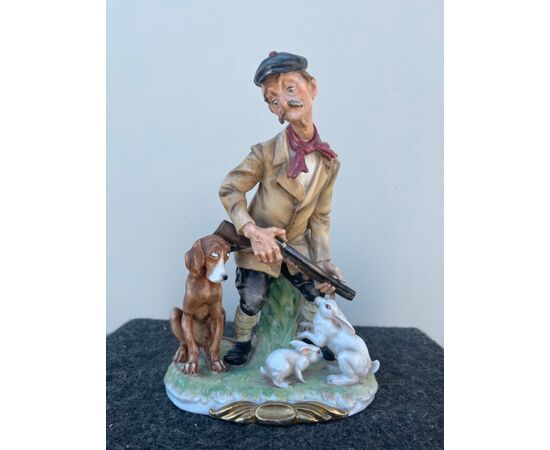 Polychrome porcelain group depicting a comic scene with a hunter.Giuseppe Cappe &#39;. (unsigned).     