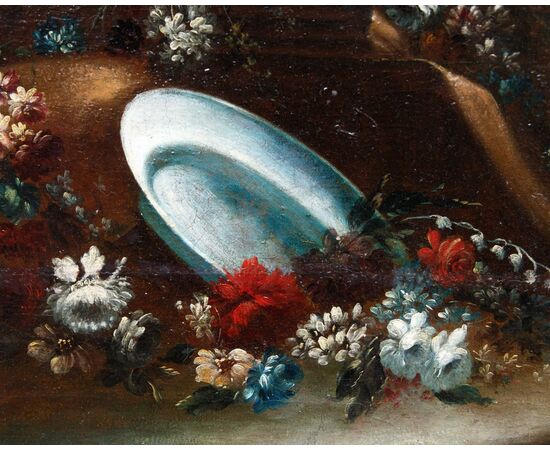 Still life with flowers, pottery and architecture in the background