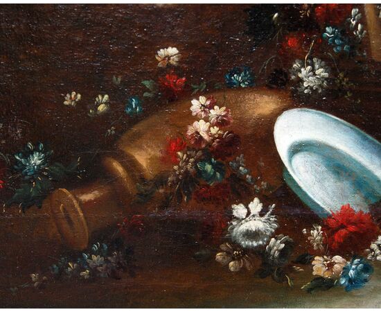 Still life with flowers, pottery and architecture in the background