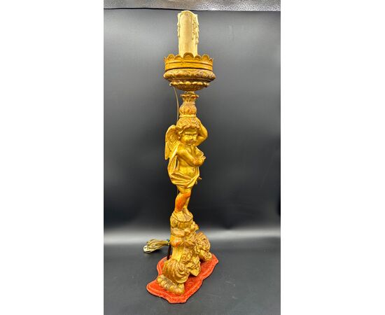 Carved and gilded wooden candlestick with cherub figure - 18th century.