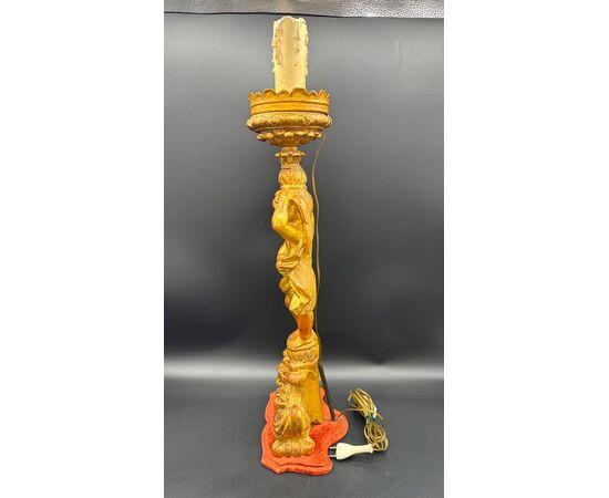 Carved and gilded wooden candlestick with cherub figure - 18th century.