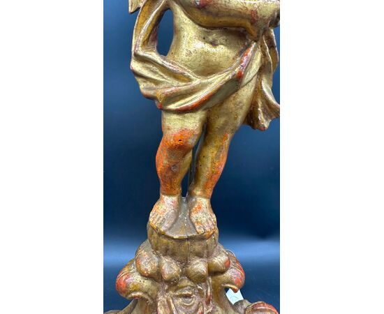 Carved and gilded wooden candlestick with cherub figure - 18th century.