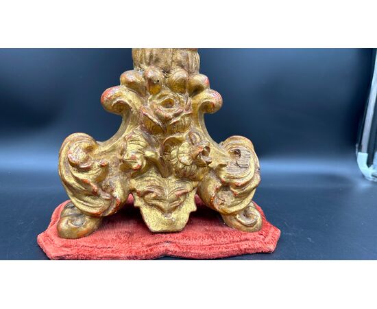 Carved and gilded wooden candlestick with cherub figure - 18th century.