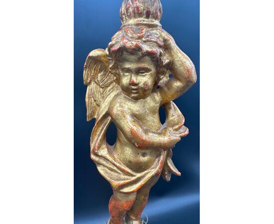 Carved and gilded wooden candlestick with cherub figure - 18th century.