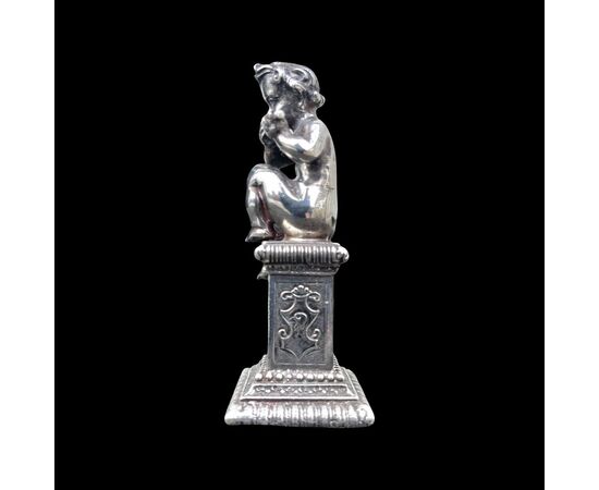 Small solid silver sculpture depicting a musical child. Italy.