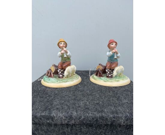 Pair of abat hour lamps with figures of shepherds in polychrome earthenware.Ronzan manufacture, Turin.     