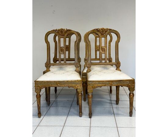 Group of four Louis XVI lacquered and gilded chairs. 18th century. Restored.