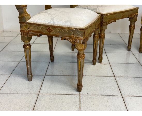 Group of four Louis XVI lacquered and gilded chairs. 18th century. Restored.