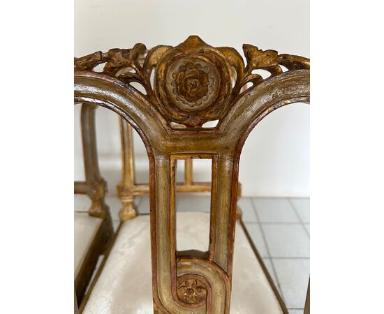 Group of four Louis XVI lacquered and gilded chairs. 18th century. Restored.