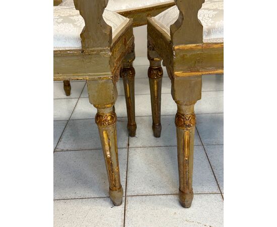 Group of four Louis XVI lacquered and gilded chairs. 18th century. Restored.
