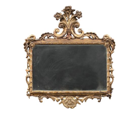 Carved and gilded wooden mirror. Italy, 18th century.