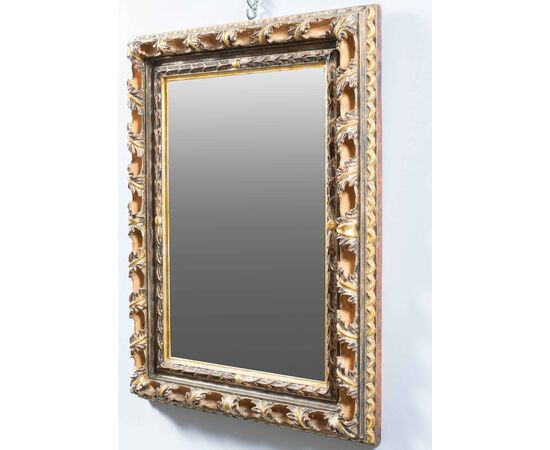 Liberty mirror in carved and gilded wood. Italy, 20th century.