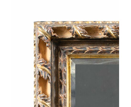 Liberty mirror in carved and gilded wood. Italy, 20th century.