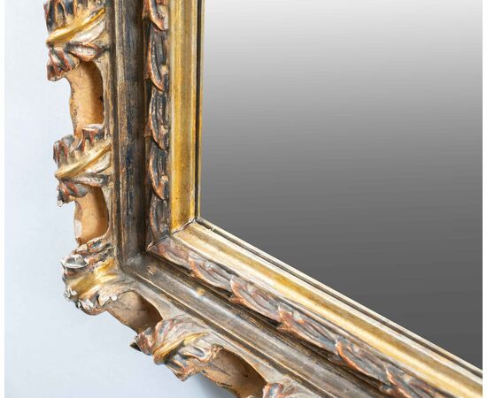 Liberty mirror in carved and gilded wood. Italy, 20th century.