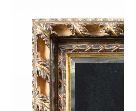 Liberty mirror in carved and gilded wood. Italy, 20th century.