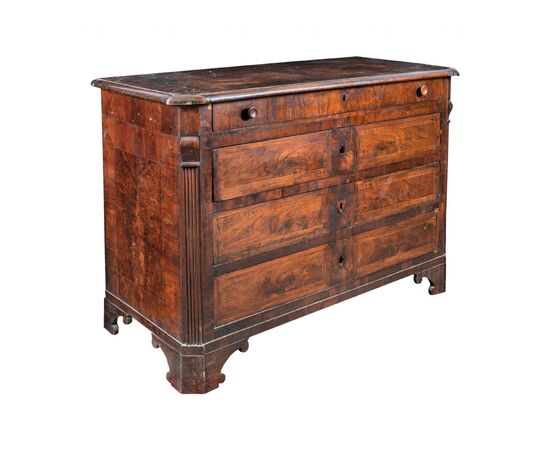 Walnut feather chest of drawers. Italy, early 19th century.