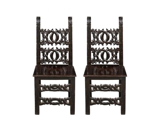 Pair of friar chairs in carved wood. Modena, 19th century.