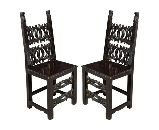 Pair of friar chairs in carved wood. Modena, 19th century.