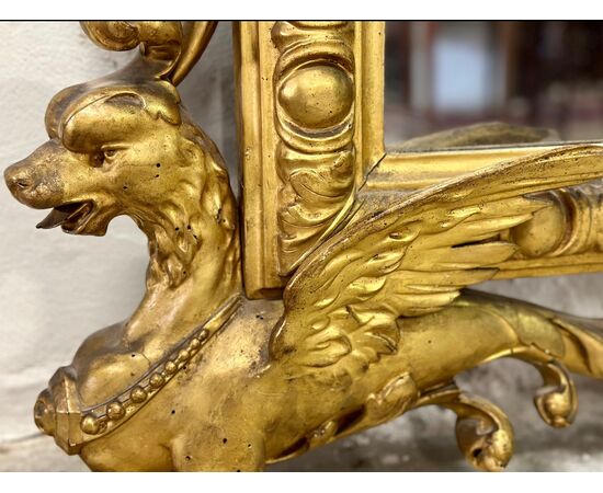 Carved and gilded wooden mirror. Tuscany, early 19th century.