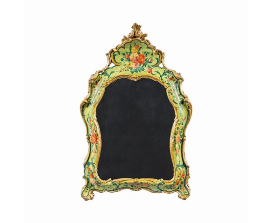 Carved, lacquered and painted wooden mirror. Venice, 18th century.